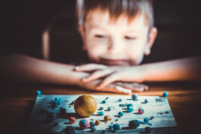 Close-up of boy looking at home