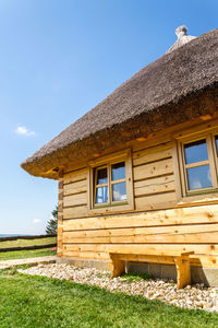 House on field against sky