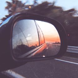 Reflection of car on side-view mirror