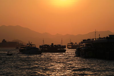 Scenic view of sea against orange sky