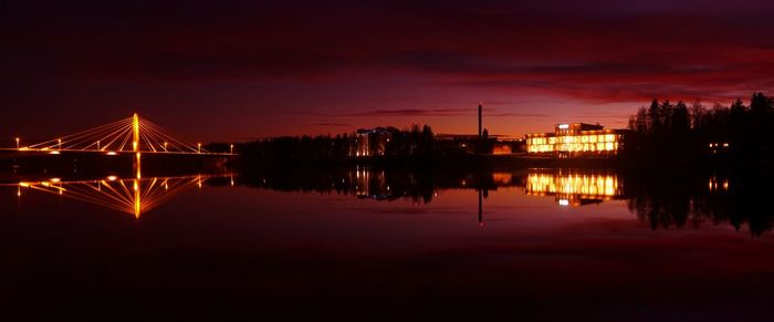 Scenic view of lake against sky at night