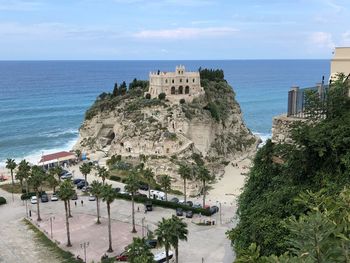 High angle view of sea and buildings against sky