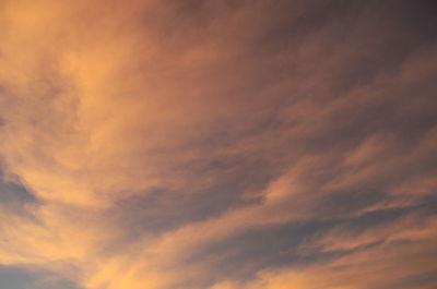 Low angle view of cloudy sky at sunset