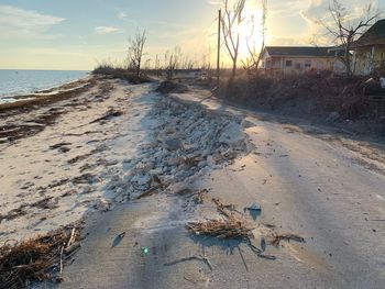 Scenic view of beach against sky during sunset