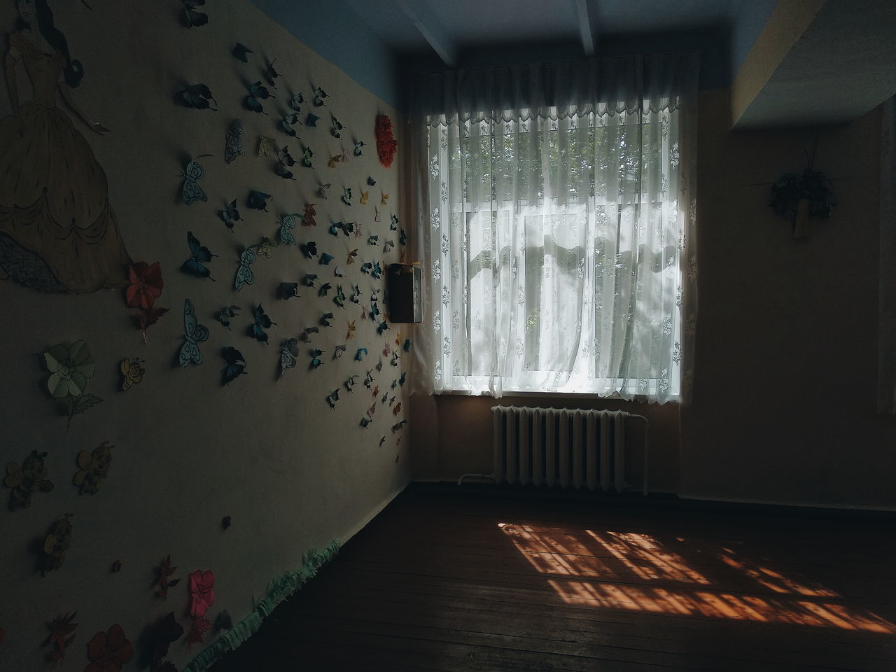 indoors, no people, day, domestic room, window, home interior, wall - building feature, architecture, curtain, empty, absence, sunlight, flooring, built structure, building, hanging, house, furniture, hardwood floor