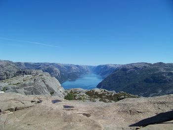 Scenic view of mountains against clear blue sky