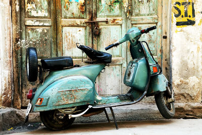 Motor scooter parked at entrance