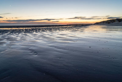 Scenic view of sea against sky at sunset