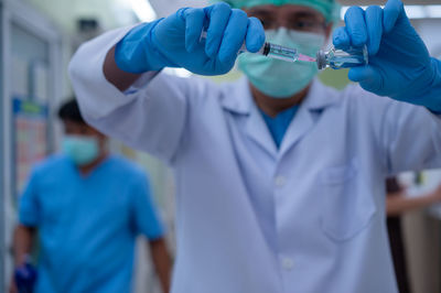 Rear view of people working