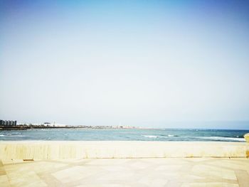 Scenic view of beach against clear sky