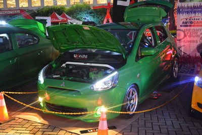 Close-up of toy car on street in city