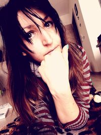 Close-up of young woman at home