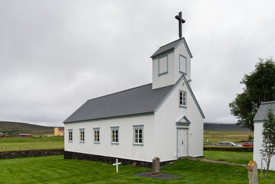 House on field against sky