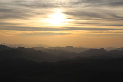 Scenic view of mountains against sky during sunset