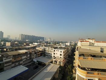 High angle view of buildings in city against clear sky