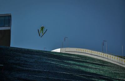 Low angle view of modern building against blue sky