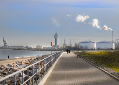 Rear view of bridge over sea against sky