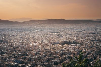 Cityscape against sky during sunset