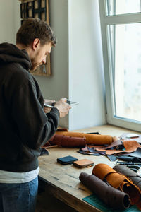 Young man using digital tablet at home