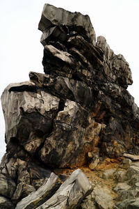 Close-up of rock formation against clear sky