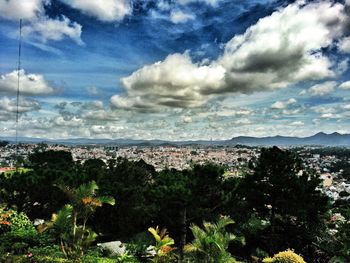 Aerial view of cityscape against sky