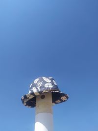 Low angle view of tower against clear blue sky