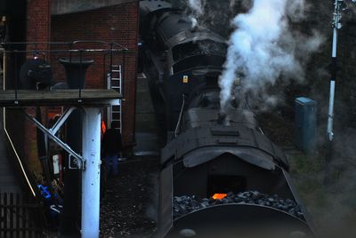 High angle view of smoke emitting from steam train