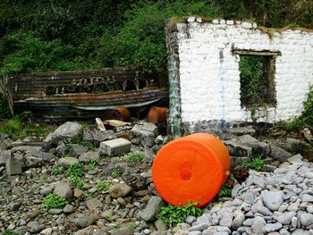 Close-up of red telephone on wall