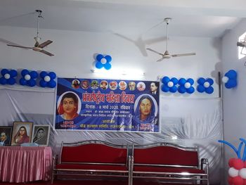 Low angle view of man hanging on ceiling