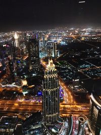 High angle view of illuminated buildings in city at night
