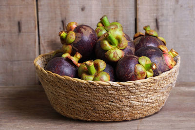 Close-up of fruits in basket on table