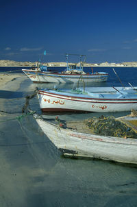 Boats in sea against sky