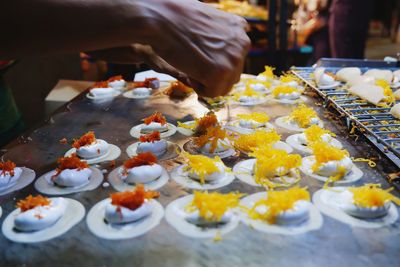 High angle view of ice cream for sale in market, thai crispy pancake, kanom buang.