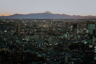 High angle view of illuminated buildings in city