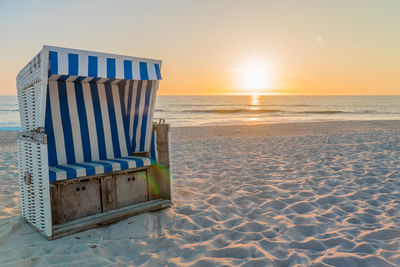 Scenic view of beach against sky during sunset