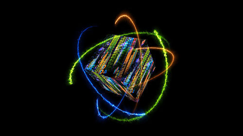 Close-up of light painting against black background
