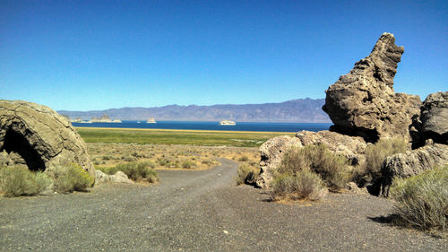 Scenic view of landscape against clear blue sky