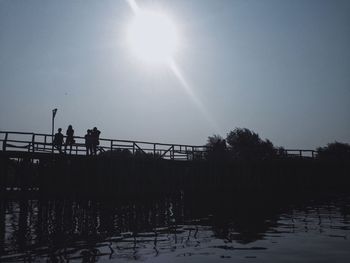 Silhouette of people at sunset