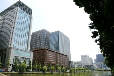 Low angle view of skyscrapers against sky