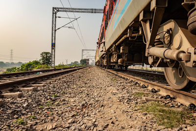 Train on railroad track against sky