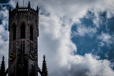 Low angle view of clock tower against sky