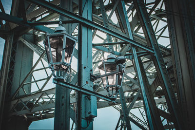 Low angle view of metallic bridge