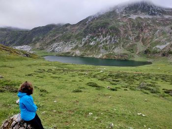 Rear view of woman looking at mountains