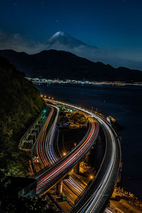 High angle view of light trails on road against sky