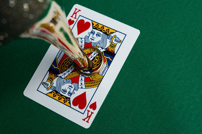 High angle view of cards and high heels on table