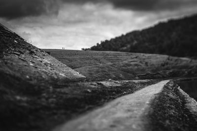 Scenic view of landscape against cloudy sky