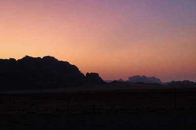 Silhouette of mountains in wadi rum desert at sunrise, jordan