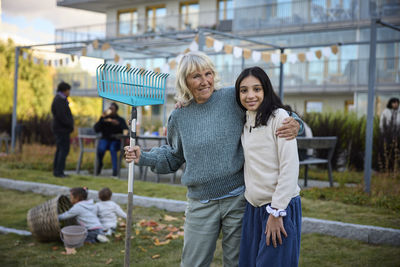 Woman and girl looking at camera