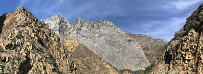 Low angle view of rock formations against sky