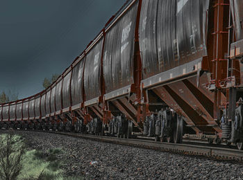 Train on railroad track against sky